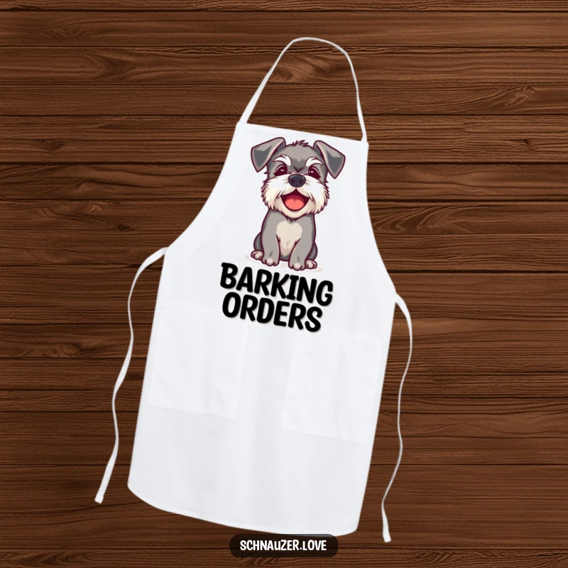 Funny apron showing a schnauzer with floppy ears barking happily, adding humor to kitchen tasks.