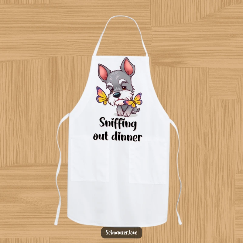 Funny Schnauzer Apron: A curious schnauzer with perked ears sniffing a butterfly, perfect for a playful cook.