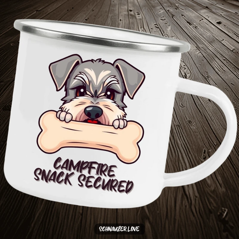 Funny Schnauzer camping mug showing a schnauzer peeking over a large bone, ready for outdoor enjoyment.