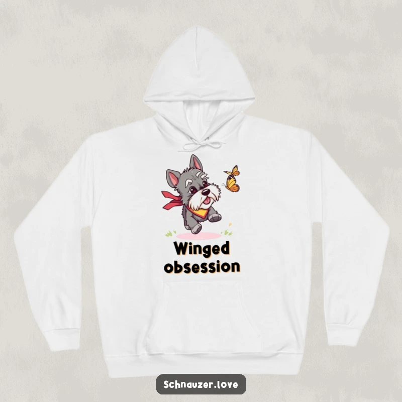 Funny hoodie depicting a schnauzer in a bandana energetically chasing a butterfly, embodying playful outdoor fun and humor.