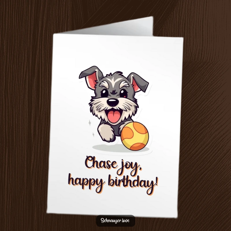 Funny Free Printable Birthday Card: A happy schnauzer with its tongue out sprints after a bright bouncy ball.