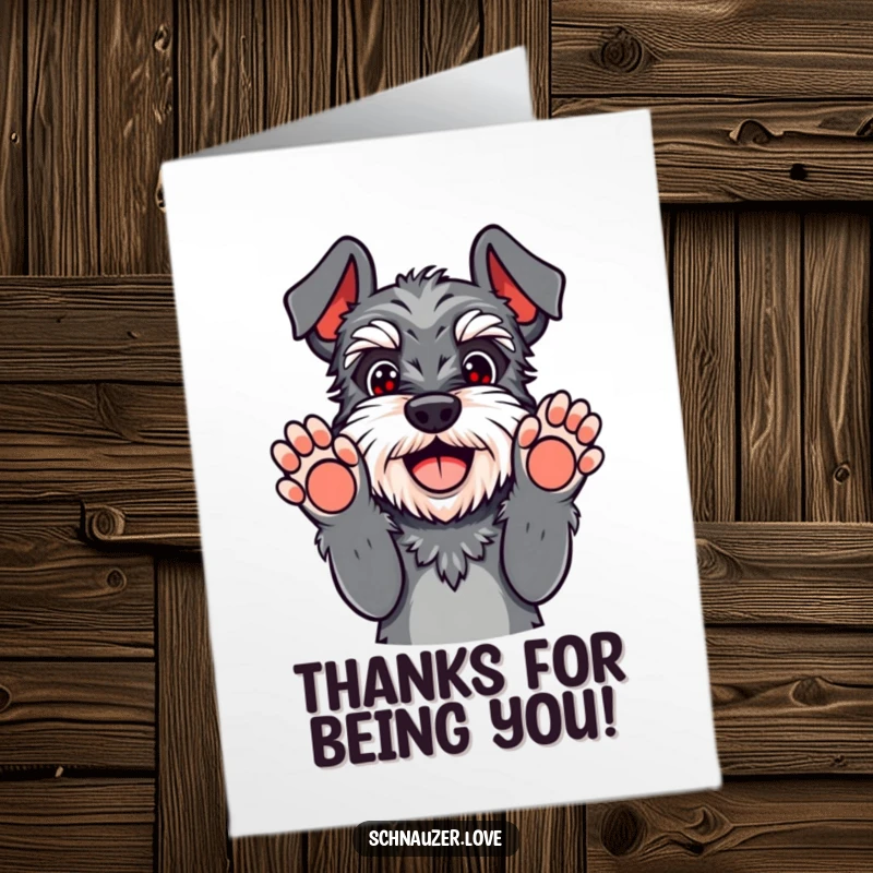 Funny free printable Schnauzer thank you card, dog playfully surrendering with paws up, conveying thanks with a smile.