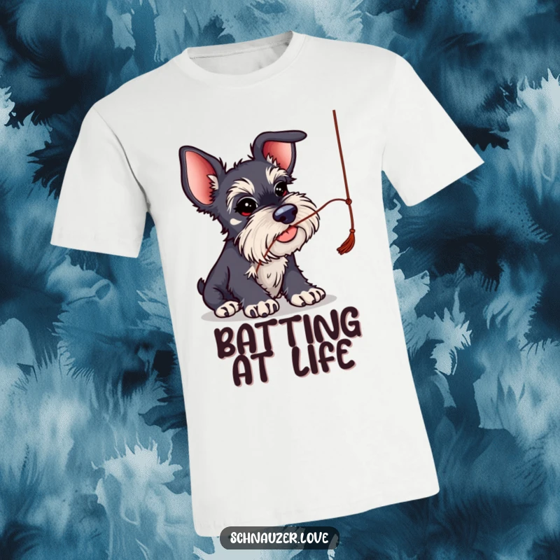 Funny Schnauzer T-Shirt: Schnauzer with oversized ears batting playfully at a dangling string, capturing a moment of humorous fun.