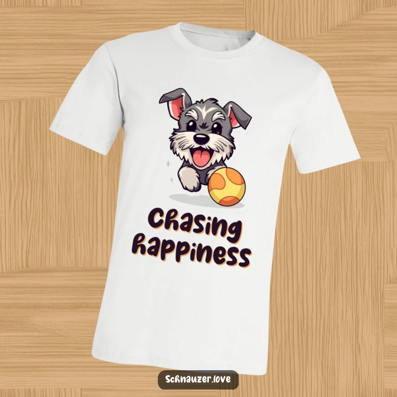 Funny schnauzer t-shirt, a fluffy dog in full pursuit of a bouncy ball, its tongue hanging out in pure joy and excitement.