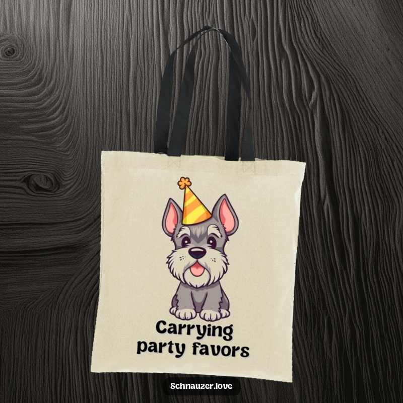 Funny Schnauzer Tote Bag depicting a schnauzer wearing a party hat and tilting its head, perfect for carrying festive items.