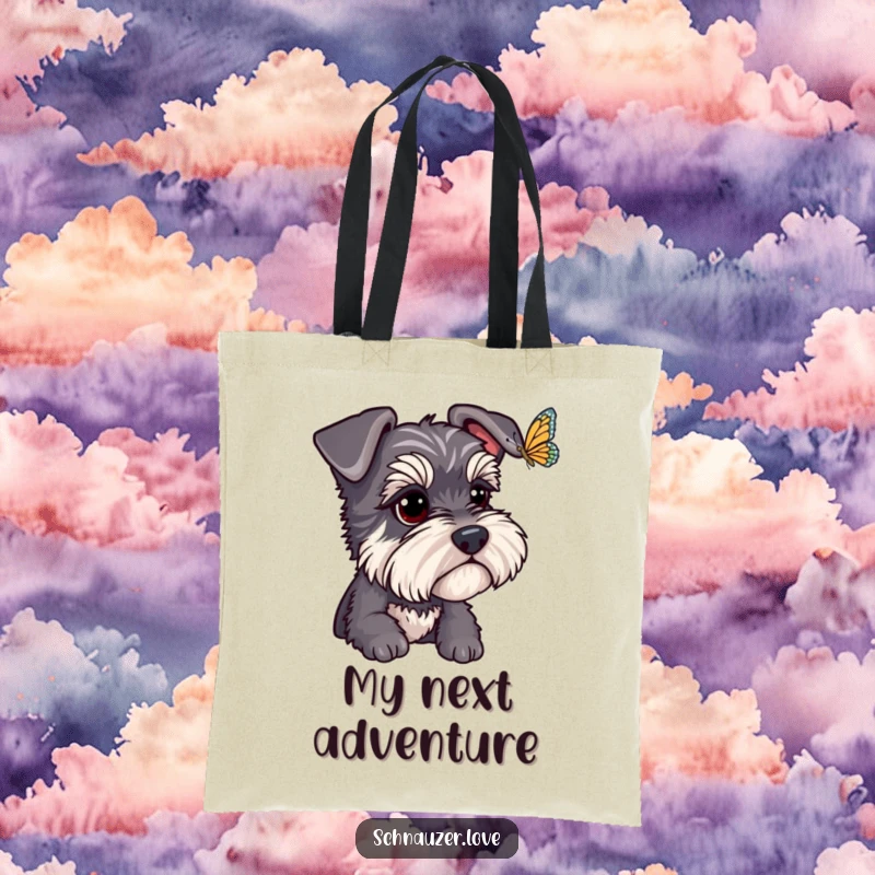 Funny Schnauzer Tote Bag: A focused schnauzer watches a fluttering butterfly, embodying a humorous and charming scene for this practical bag. Funny gift.